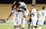 Al Ahli players celebrate during the quarter-final against Al Hussein on Sunday.
