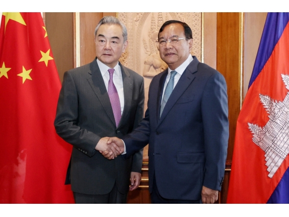 CAMBODIA-CHINA-DIPLOMACY
This handout photo taken and released by Agence Kampuchea Press (AKP) on April 23, 2026 shows Prak Sokhonn (R), Cambodian Deputy Prime Minister and Minister of Foreign Affairs and International Cooperation, shaking hands with China's Foreign Minister Wang Yi (L) during a meeting at the Ministry of Foreign Affairs in Phnom Penh. China's top diplomat Wang Yi is on a three-country tour of Southeast Asia this week, visiting Thailand and Myanmar after a first stop in Cambodia, Chinese officials said. (Photo by Handout / Agence Kampuchea Press (AKP) / AFP) 
