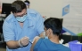 A PHCC nurse administering vaccine for a patient