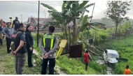 This handout picture taken and released on May 1, 2026 by the Grobogan Police Traffic Unit shows a vehicle struck by a passenger train, killing at least four people as it attempted to cross an unguarded railway crossing in Grobogan, Central Java. Photo by Handout / GROBOGAN POLICE TRAFFIC UNIT / AFP