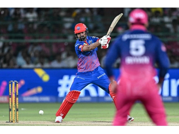 Delhi Capitals' Indian cricket player KL Rahul (L) plays a shot during the 2026 Indian Premier League (IPL) T20 match between Rajasthan Royals and Delhi Capitals at the Sawai Mansingh Stadium in Jaipur on May 1, 2026. (Photo by Manan Vatsyayana / AFP) 