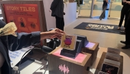 A customer shops at the Audible Story House in New York, on April 30, 2026. The pop-up store labeled as a 