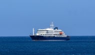 A general view of the cruise ship MV Hondius stationary off the port of Praia, the capital of Cape Verde, on May 3, 2025. Photo by AFP