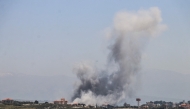 Smoke rises from the site of an Israeli airstrike that targeted the southern Lebanese village of al-Halloussiyah on May 8, 2026. (Photo by KAWNAT HAJU / AFP)