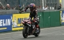Aprilia Racing's Spanish rider Jorge Martin celebrates as he crosses the finish line to win the Moto GP Grand Prix of France at Le Mans, northwestern France, on May 10, 2026. (Photo by Loic VENANCE / AFP)