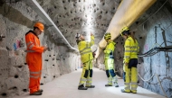 (From L) ETH Zurich Master students Alessandro Profeta, Alba Zappone and ETH Zurich doctoral students Fiona Dresler-Dorn and Lu Tian examine the cracks in the BedrettoLab tunnel on April 29, 2026. (Photo by Ennio Leanza / AFP)
