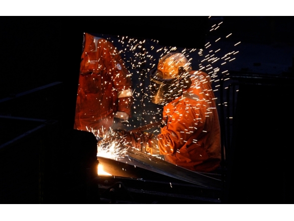 (Files) Workers in the rail and sections hot end rolling mill at the British Steel site in Scunthorpe, Lincolnshire, eastern England on April 17, 2025. (Photo by Danny Lawson / Pool / AFP)
 