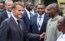 France's President Emmanuel Macron (L) speaks with Kenya's Sabastian Sawe (2nd R), the first man to run under two hours for a marathon in race conditions at a sport demonstration during the Africa Forward summit in Nairobi on May 11, 2026. (Photo by Ludovic Marin / AFP)
