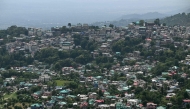A general view of houses along the hilltop as seen from Indru Nag near Dharamsala on May 15, 2026. (Photo by Sajjad HUSSAIN / AFP)