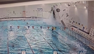 A surveillance camera screenshot shows a car plunging into a swimming pool at a sports center in South Gyeongsang Province on Saturday. Photo credit: Gyeongnam Provincial Police via The Korea Herald