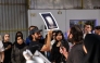 Habeeb Abu-Futtaim (holding the image) and Yousef Bahzad (with the mic) are previewing the artwork. Pic: Maria Ovsyannikova