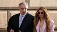 (FILES) Colombian singer Shakira arrives with her lawyer Pau Molins (L) at the High Court of Justice of Catalonia for her trial on tax fraud, in Barcelona on November 20, 2023. (Photo by Pau Barrena/ AFP)