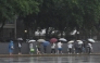 Pedestrians walk in the rain in Beijing, capital of China, May 17, 2026. (Xinhua/Xie Han)