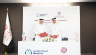 Director of the International Cooperation and Agreements at Qatar Media Corporation Abdulla Ghanim Almuhannadi and CEO of Media City Qatar Hamad Omar A. Al-Mannai exchanging document after signing an agreement in a ceremony held yesterday at QMC premises.