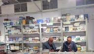 Abdulmonem Kamil (left) at his booth.