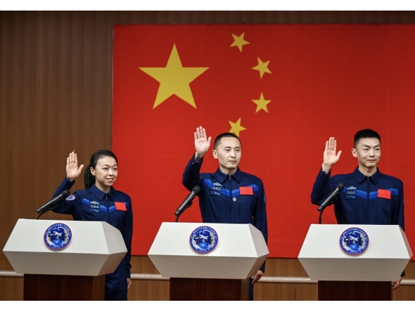 Chinese astronauts Zhu Yangzhu (C), Zhang Zhiyuan (R) and Lai Ka-ying, for the upcoming Shenzhou-23 crewed spaceflight mission, meet the press at the Jiuquan Satellite Launch Center in northwest China, May 23, 2026. (Xinhua/Lian Zhen)