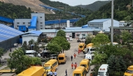 A general view of rescue team members and emergency vehicles arriving at the Liushenyu coal mine after a gas explosion in Changzhi, in northern China's Shanxi province on May 23, 2026. (Photo by CNS / AFP) 