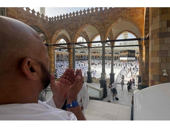 A Muslim worshipper prays near the Kaaba, Islam's holiest shrine, at the Grand Mosque complex in the holy city of Makkah on May 22, 2026, ahead of the annual Hajj pilgrimage. (Photo by Zain JAAFAR / AFP)