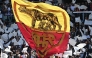 Roma's supporters wave a giant flag ahead of the Italian Serie A football match between Roma and Lazio at Olympic stadium in Rome on May 17, 2026. (Photo by Isabella BONOTTO / AFP)