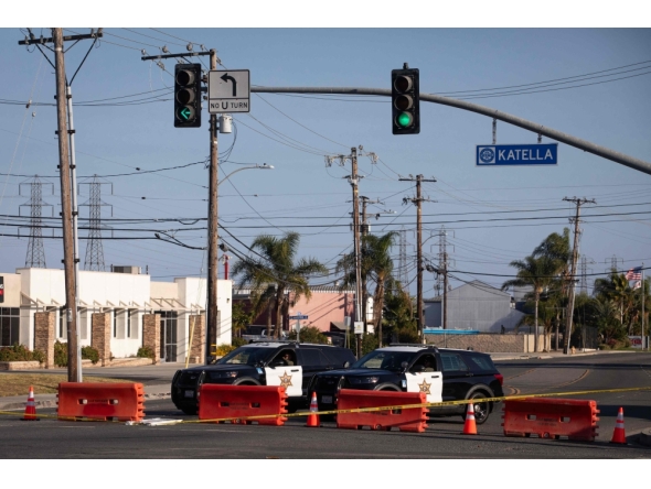 Orange County sheriff deputies block Western Avenue at Katella Avenue as roads remain closed after a chemical leak in Garden Grove, California, on May 24, 2026. (Photo by Blake Fagan / AFP)