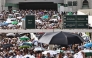 Muslim worshippers walk along the Grand Mosque complex under the water-mist fans installed in the holy city of Mecca on May 24, 2026, ahead of the annual Hajj pilgrimage. (Photo by Zain Jaafar / AFP)