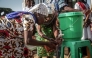 Parishioners wash their hands before entering the church following local authorities’ instructions to limit the spread of the Ebola outbreak in eastern Democratic Republic of the Congo in Bunia on May 24, 2026. (Photo by Seros Muyisa / AFP)