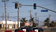 Orange County sheriff deputies block Western Avenue at Katella Avenue as roads remain closed after a chemical leak from a large storage tank prompted evacuations in Garden Grove, California, on May 24, 2026. Photo by Blake Fagan / AFP