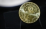 This photograph shows a Marianne-Or gold coin bullion displayed at La Monnaie de Paris in Paris on May 21, 2026. (Photo by Simon Wohlfahrt / AFP)