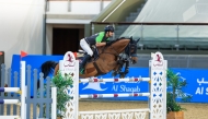 Saudi Arabia’s Khaled Al Hadi guides Capoen during the Youth Champions class event. 
