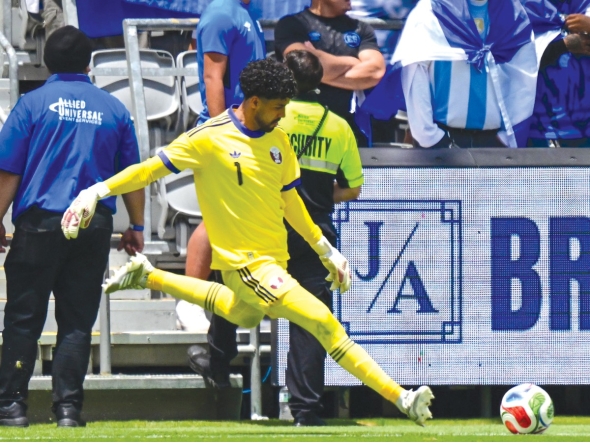 Qatar goalkeeper Mahmoud Abunada in action during the match against El Salvador on Saturday.  