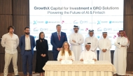Ambassador of Ukraine to Qatar H E Andrii Kuzmenko and QC Board Member Mohamed bin Ahmed Al Obaidli with other officials witnessing the signing by Chairman of GrowthX Capital Hamad Mubarak Al Hajri and President of Grow Solutions Maria Shevchenko.