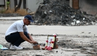A tribute is set up for Air India Flight 171 plane crash victim Vijay Rupani, former Gujarat chief minister, at the crash site on the first anniversary of the disaster in Ahmedabad on June 12, 2026. Photo by Shammi MEHRA / AFP