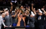 New York Knicks owner James Dolan lifts the Larry O'Brien Championship Trophy after his team defeated the San Antonio Spurs in Game Five of the 2026 NBA Finals at Frost Bank Center on June 13, 2026 in San Antonio, Texas. Gregory Shamus/Getty Images/AFP (Photo by Gregory Shamus / GETTY IMAGES NORTH AMERICA / Getty Images via AFP)