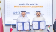 Founding Chairman of GORD and GCC Dr. Yousef M. Alhorr, and Director General of EPDA Dr. Mohammed bin Yousif Al Madfaei showing documents after signing an agreement.