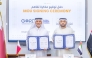 Founding Chairman of GORD and GCC Dr. Yousef M. Alhorr, and Director General of EPDA Dr. Mohammed bin Yousif Al Madfaei showing documents after signing an agreement.