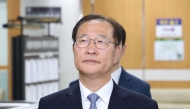 Former Korean Justice Minister Park Sung-jae arrives for his trial at the Seoul Central District Court in Seoul on June 22, 2026. (Photo by YONHAP / AFP)