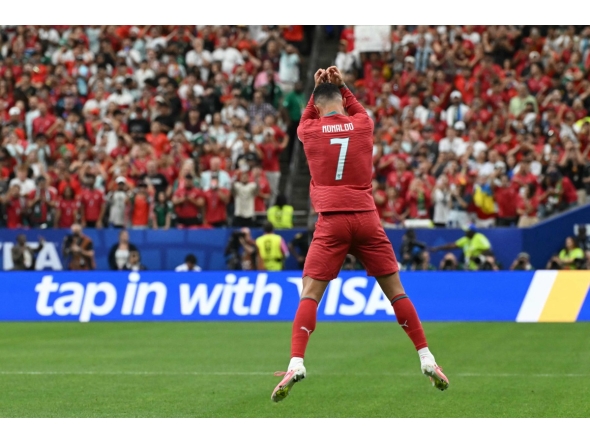Portugal's forward #07 Cristiano Ronaldo celebrates after scoring the opening goal during the 2026 World Cup Group K football match between Portugal and Uzbekistan at the Houston Stadium in Houston on June 23, 2026. (Photo by RONALDO SCHEMIDT / AFP)