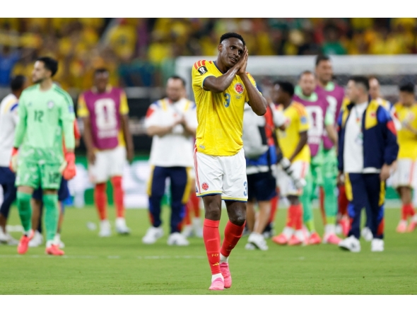 Colombia's defender #03 Jhon Lucumi celebrates after winning the 2026 World Cup Group K football match between Colombia and Democratic Republic of Congo. (Photo by Ulises Ruiz / AFP)