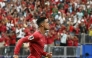 Cristiano Ronaldo celebrates after scoring the opening goal against Uzbekistan. 