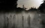 People off in a water fountain as Spain experiences a heatwave, in Madrid. (Photo by Oscar Del Pozo / AFP)