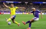 Yuto Nagatomo #5 of Japan crosses the ball while Benjamin Nygren #10 of Sweden attempts to block. Alex Slitz/Getty Images/AFP