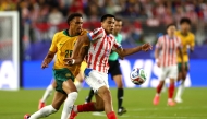 Tete Yengi #26 of Australia competes for the ball against Diego Gomez #8 of Paraguay. Dean Mouhtaropoulos/Getty Images/AFP