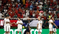 Spain's players celebrate after winning the 2026 World Cup Group H football match between Uruguay and Spain at the Guadalajara Stadium in Zapopan on June 26, 2026. (Photo by Ulises Ruiz / AFP)