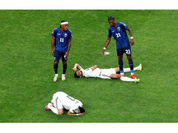 Abdulelah Al-Amri #4 and Ali Lajami #3 of Saudi Arabia react after the 0-0 draw during the FIFA World Cup 2026 Group H match between Cabo Verde and Saudi Arabia at Houston Stadium on June 26, 2026 in Houston, Texas. Charlotte Wilson/Getty Images/AFP