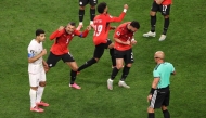 Egypt players react as referee Szymon Marciniak calls an offside violation and overturns the goal by Shoja Khalilzadeh #4 of IR Iran following a VAR review. Stu Forster/Getty Images/AFP