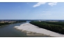 This aerial photograph shows a sandbar on the Po River at Pontelagoscuro, northeastern Italy, on June 25, 2026. (Photo by Stefano Rellandini / AFP)
