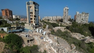 This aerial view shows collapsed buildings in Catia La Mar, La Guaira state, Venezuela, on June 27, 2026, following earthquakes that struck the region. Nearly 1,000 people have been killed and more than 50,000 remain missing after two consecutive earthquakes in Venezuela, where growing anger has been reported over the lack of official aid to swiftly rescue survivors. (Photo by Federico PARRA / AFP)