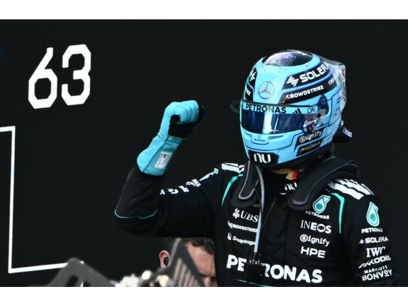 Mercedes' British driver George Russell celebrates after winning the Formula One Austrian Grand Prix at the Red Bull Ring race track in Spielberg, Austria on June 28, 2026. (Photo by Joe Klamar / AFP)