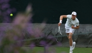 Italy's Jannik Sinner returns to his training partner at the practice courts at The All England Lawn Tennis and Croquet Club in Wimbledon on June 28, 2026. (Photo by Adrian Dennis / AFP)