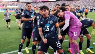 Gustavo Gomez #15 of Paraguay celebrates with teammates after Jose Canale #13 scores the winning penalty in a penalty shootout during the FIFA World Cup 2026 Round Of 32 match between Germany and Paraguay at Boston Stadium on June 29, 2026 in Foxborough, Massachusetts. (Photo by ALEXANDER HASSENSTEIN / GETTY IMAGES NORTH AMERICA / Getty Images via AFP)